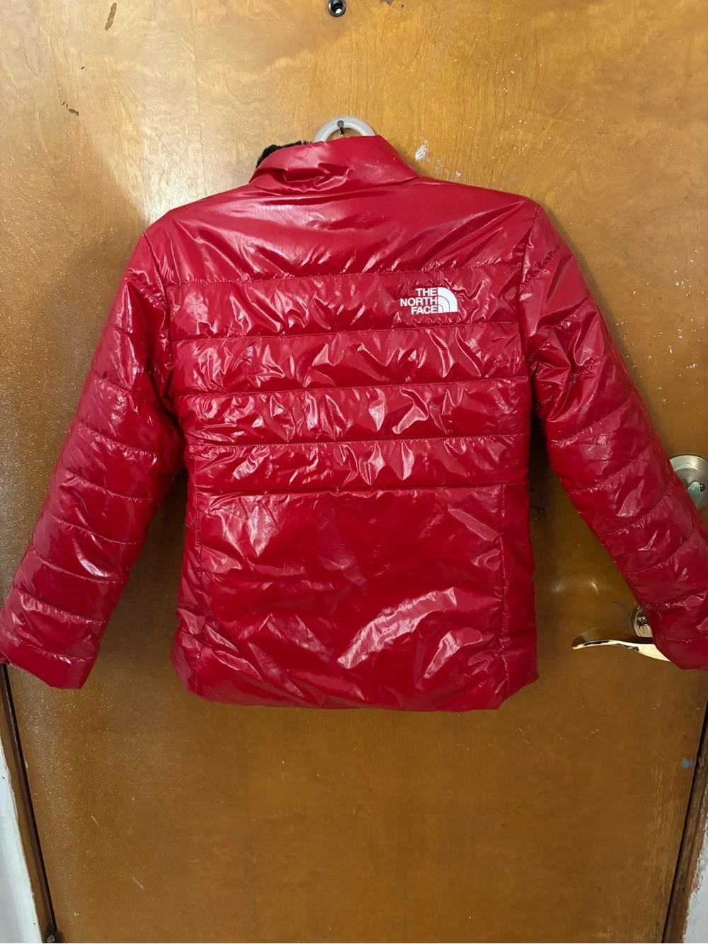 The North Face coat.  Girls. Red reversible
